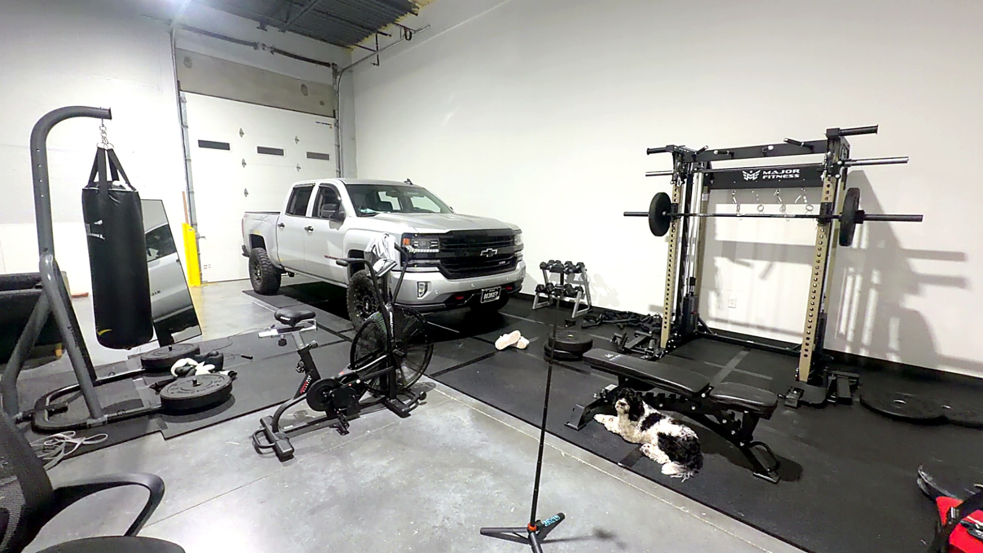 Squat rack and free weight area at Apex Performance